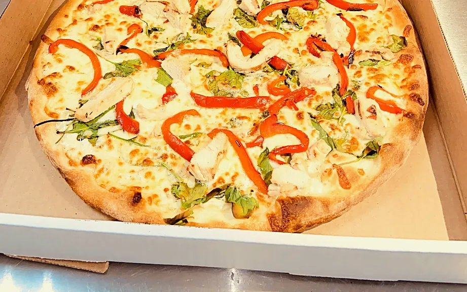 Pizza with chicken and red peppers
